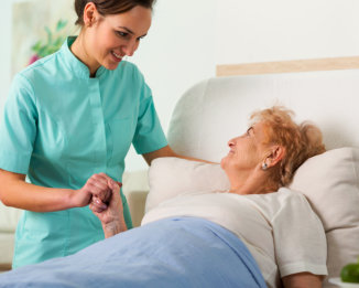 a female nurse with an elderly patient