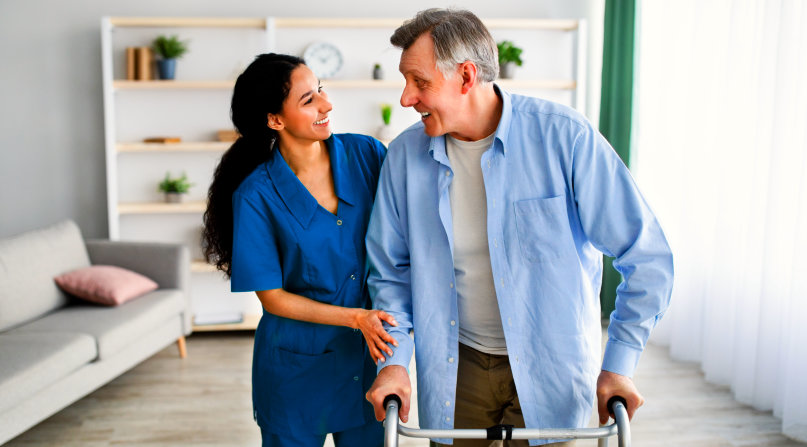 image of an elderly man with a female caregiver